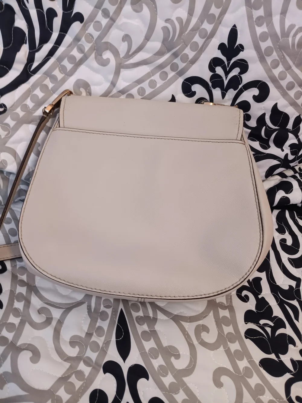 kate spade cream saddle crossbody with gold-tone logo